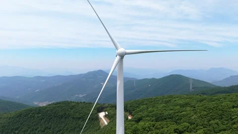 Drone flies forward toward motionless wind turbine hub in Pyeongchang mountains Stock Footage 340200214