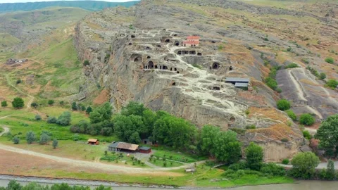 Drone flies forward toward Uplistsikhe in Georgia, approaching the ancient cave Stock Footage 340765315