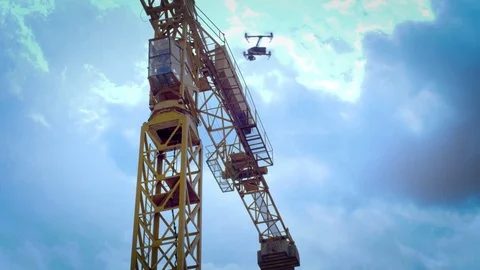 Drone flies in front of construction crane Stock Footage 80151849