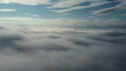 Drone flies high back in sky through fluffy clouds. Nature concept Stock Footage 293670869