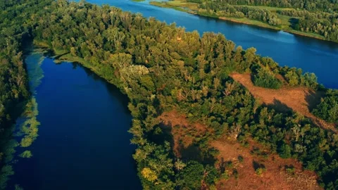 Drone flies high over beautiful summer landscape with a wide river and green  Stock Footage 140957073