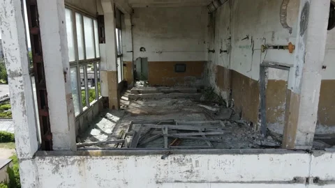 Drone flies inside a Smashed Windows of an Abandoned Soviet Chemical Factory 4k Stock Footage 135896800