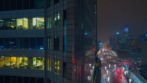 Drone flies from left to right, we see glazed skyscrapers with offices. Video stock 108559940
