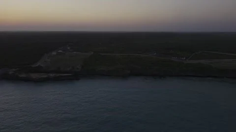 Drone flies left in ultra wide shot of Mtende Beach during high tide Stock Footage 344144178