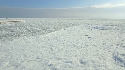 Drone flies low and fast over ice in the Black Sea Stock Footage 72586881