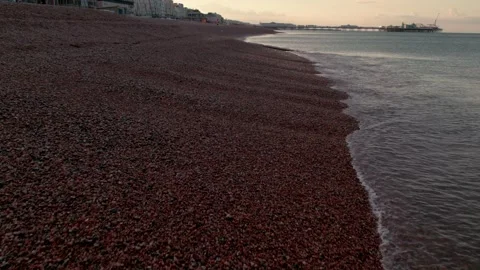 Drone flies low over Brighton Beach Stock Footage 219312636