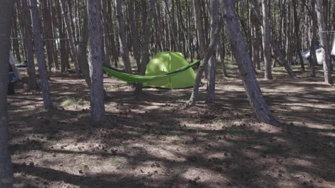 Drone flies low over a campsite Stock Footage 229625631