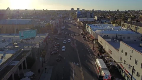 Drone flies low over NORTH PARK sign in San Diego facing west Stock Footage 102821983
