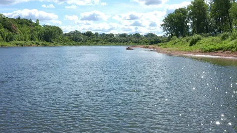 A drone flies low over the river on a sunny morning. Stock Footage 119073117