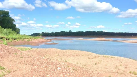 A drone flies low over the shallowed part of the river. Stock Footage 119072912