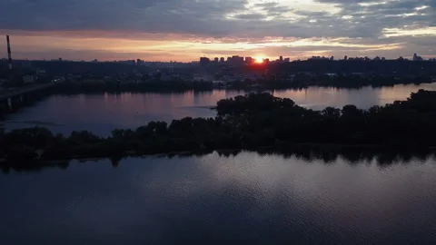 Drone flies low over water during sunset. Stock Footage 131919939