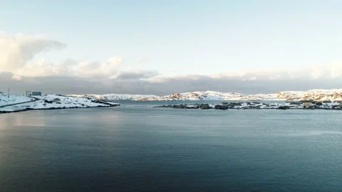 The drone flies low over the water in the bay of the North Sea. Fishing village Stock Footage 169462919