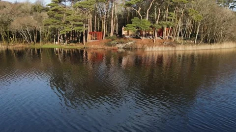 The drone flies from the middle of the lake to the shore. Ireland. Stock Footage 231144904