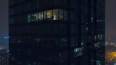 The drone flies up a modern, glazed skyscraper. Video stock 108564194