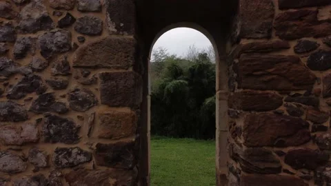 A drone flies into a narrow window to see the landscape 動画素材 150361628