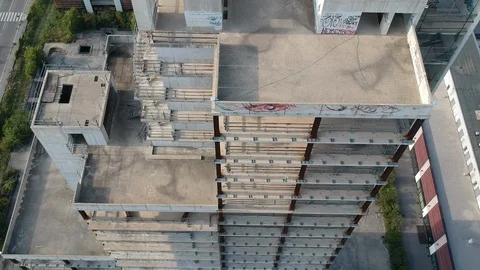 Drone flies near an abandoned construction site, high-angle shot Stock Footage