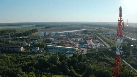 A drone flies near a mobile communications tower, over the forest Stock Footage 162000109