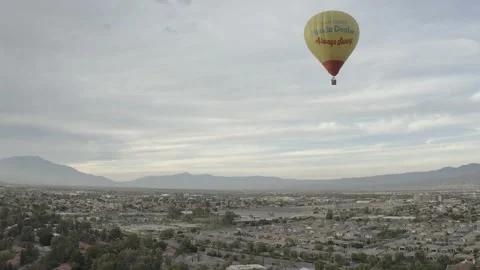 Drone flies next to hot air balloon Stock-Footage 168317496