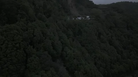 Drone flies north over forested valley to the mountain town of Sanguinho Stock Footage 310978677