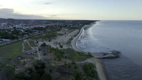 Drone flies north over Plage de la Cocoteraie and Grand Parc de la Cocoteraie Stockbeeldmateriaal 289039931