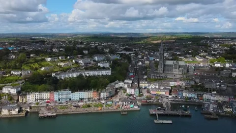 Drone flies from the ocean to the St Colman's Cathedral in Cobh, Ireland Video stock 267079410