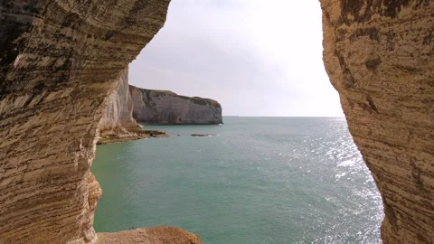 Drone Flies Out Through Chalk Arch At Etretat Cliffs Stock Footage 341134243