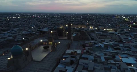 A drone flies over the architectural complex Poi-Kalon among old houses in Stock Footage 255442456