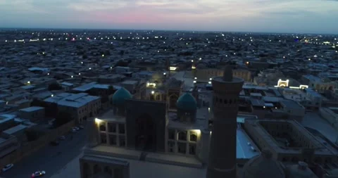 A drone flies over the architectural complex Poi-Kalon among old houses in Stock Footage 256291336