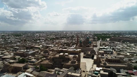 A drone flies over the architectural complex Poi-Kalon in old Bukhara Stock Footage 264028499