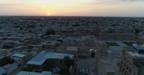 A drone flies over the architectural complex Poi-Kalon among old houses in Stock Footage 271166303