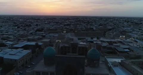 A drone flies over the architectural complex Poi-Kalon among old houses in Stock Footage 307990852