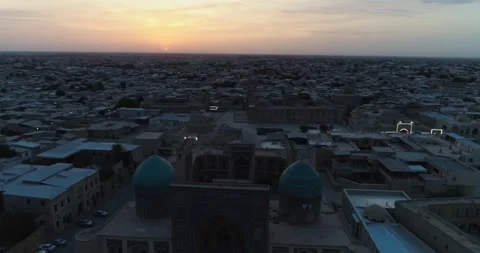 A drone flies over the architectural complex Poi-Kalon among old houses in Stock Footage 340870304