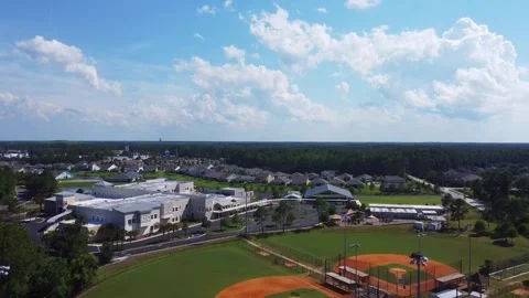 Drone Flies Over Baseball Field and School in Florida Neighborhood Community Stock Footage 244609269