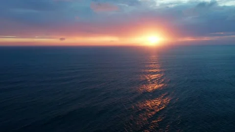 Drone flies over Beautiful ocean during sunset in summer. Stock Footage 303047251