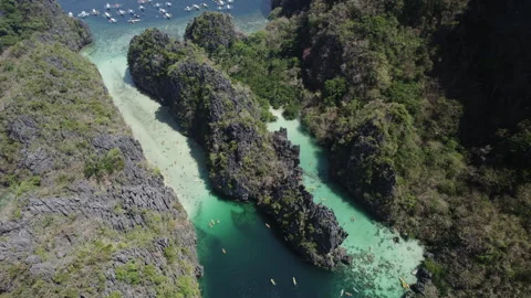 Drone flies over a big lagoon in El Nido Stock Footage 273175485