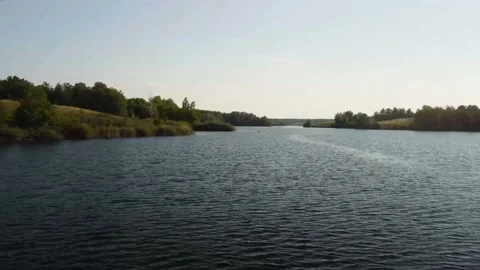 The drone flies over the blue lake Stock Footage 224847018