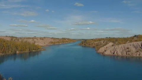 Drone flies over the blue river. Beautiful landscape with a meander river Stock Footage 165284994