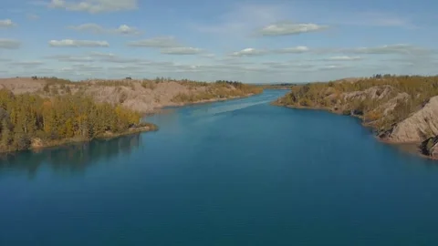 Drone flies over the blue river. Beautiful landscape with a meander river Stock Footage 166136968