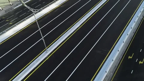 A drone flies over a bridge in the city. Sunny summer day Stock Footage 309325261