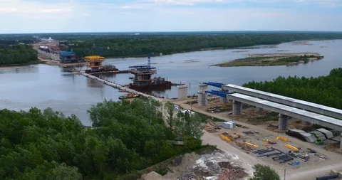 The drone flies over the bridge construction site. 스톡 동영상 113287825