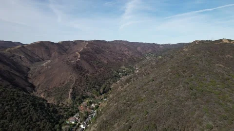 Drone flies over Burnt Down Canyon from Palisades Fire 2025 in Los Angeles Stock Footage 302693324