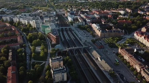 Drone flies over central station, tilts to horizon in Lund, Sweden at sunset Video stock 109056618