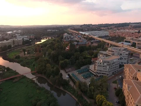Drone flies over Centurion towards Gautrain station at sunset Video stock 80721088