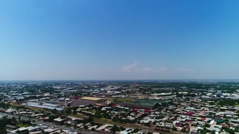 The drone flies over the city and takes pictures of a large passenger plane Stock Footage 258115210