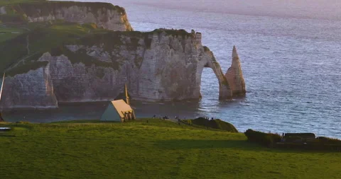 A drone flies over the coastline with chalk cliffs in Etretat, France. Aerial Video stock 241221978