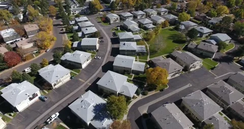 Drone flies over condo complex in a suburb. 스톡 동영상 244822821