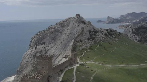A drone flies over the Consular Castle of the Genoese fortress Stock Footage 124797398