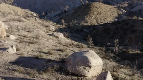 A drone flies over the Devil's Punch Bowl in California, revealing the Stock Footage 280129855