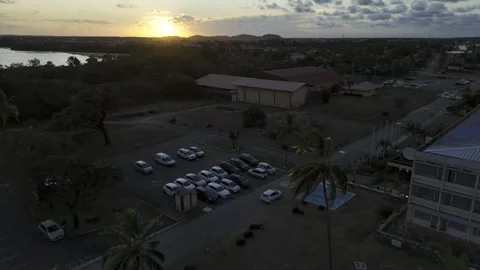 Drone flies over Dreyfus Tower and up into the sunset in Kourou Stock Footage 289131267