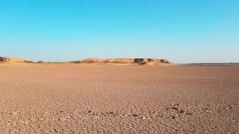 Drone flies over dry-type playa among the desert Stock Footage 218726585
